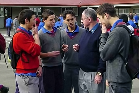 Fr Chris Martin chats with the students in the yard at Hato Paora College.